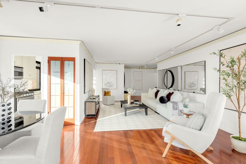 Living room toward the gallery and kitchen at 10 West 66th Street 29E, Lincoln Square — photo 9 of 9