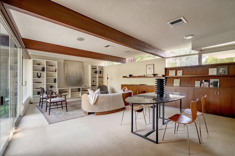 Living and dining room under beams at 1024 Armada Drive, Pasadena — photo 5 of 9