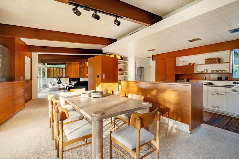 Dining room toward the walnut kitchen at 1024 Armada Drive, Pasadena — photo 9 of 9