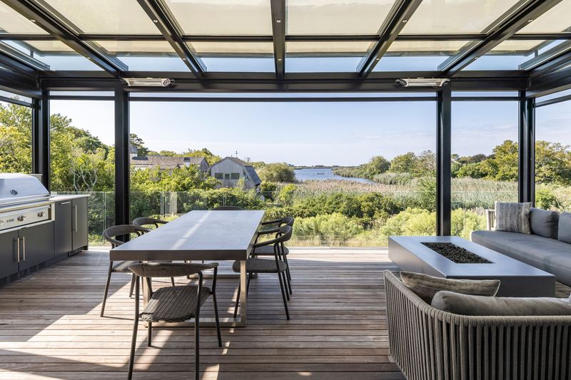 Covered outdoor room fire table at 1076 Ocean Road, Bridgehampton — photo 4 of 11