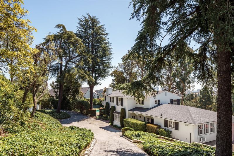 Curving drive and motor court at 10810 Ambazac Way, Bel Air — photo 2 of 12
