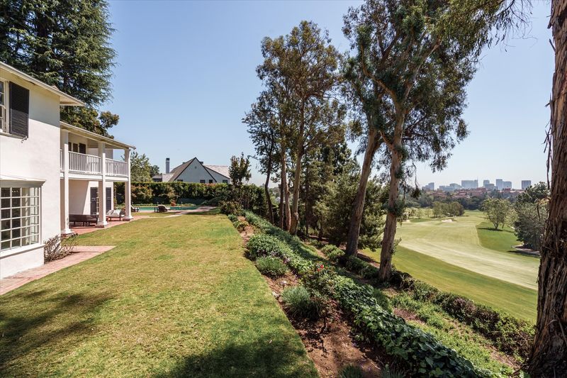 Back lawn over the Bel-Air Country Club fairways at 10810 Ambazac Way, Bel Air — photo 3 of 12