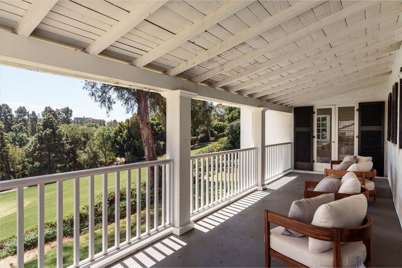 Covered upper porch over the golf course at 10810 Ambazac Way, Bel Air — photo 7 of 12