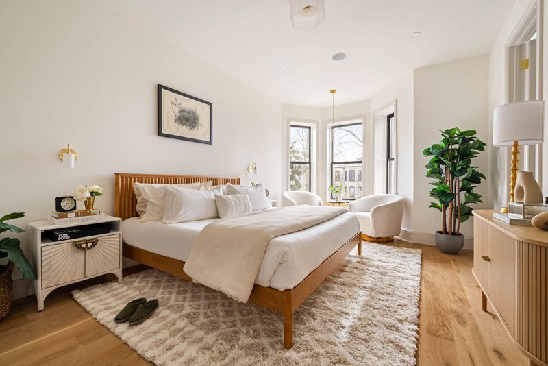 Bedroom with bay windows at 1102 Prospect Place, Crown Heights — photo 8 of 9
