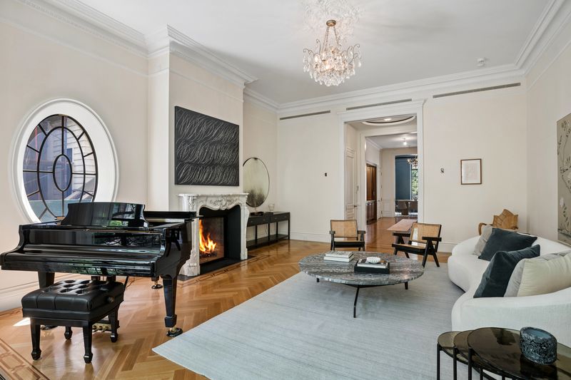 Parlor living room with marble fireplace and grand piano at 111 East 81st Street, Upper East Side — photo 3 of 8