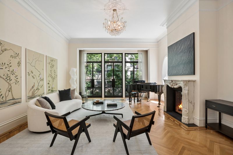 Living room toward garden-facing steel windows at 111 East 81st Street, Upper East Side — photo 4 of 8