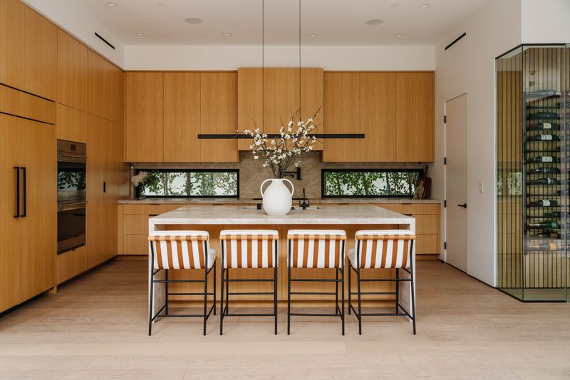 White oak kitchen and wine cellar at 116 S Gretna Green Way, Brentwood — photo 4 of 10