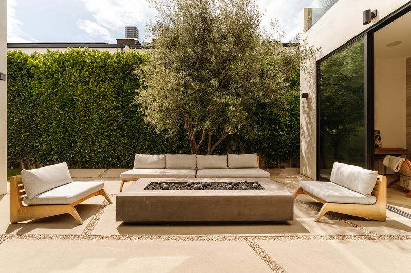 Courtyard lounge under olive tree at 116 S Gretna Green Way, Brentwood — photo 6 of 10
