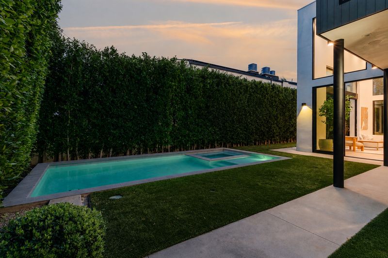 Pool, spa and lawn at sunset at 116 S Gretna Green Way, Brentwood — photo 10 of 10