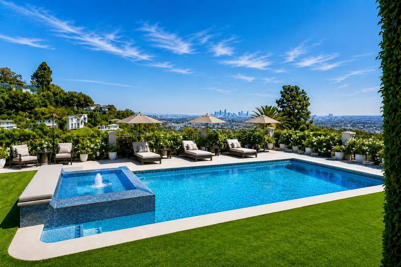 Pool and lawn with views to Downtown Los Angeles at 1260 St Ives Place, Bird Streets, Hollywood Hills — photo 2 of 6