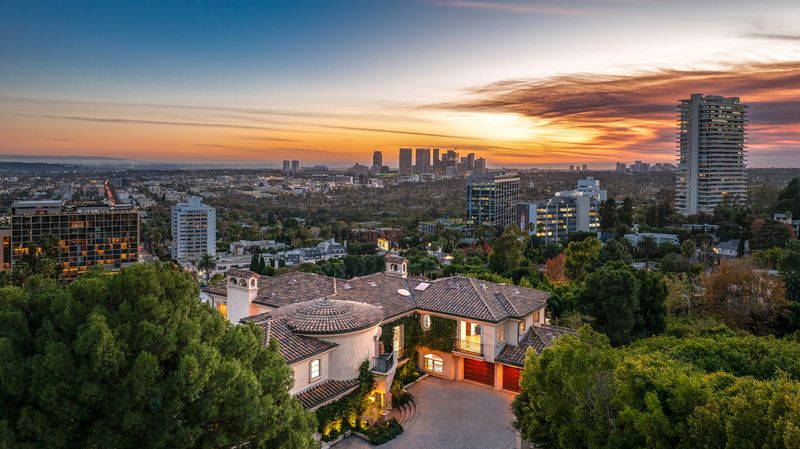 City-to-ocean view at sunset at 1260 St Ives Place, Bird Streets, Hollywood Hills — photo 5 of 6