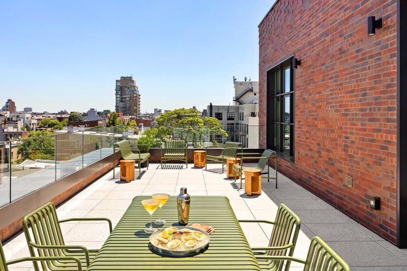 Private terrace toward the Manhattan skyline at 127 Kent Avenue PH1A, Williamsburg — photo 8 of 8