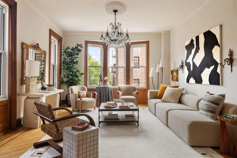 Living room toward windows at 15 Clark Street 4A, Brooklyn Heights — photo 2 of 9