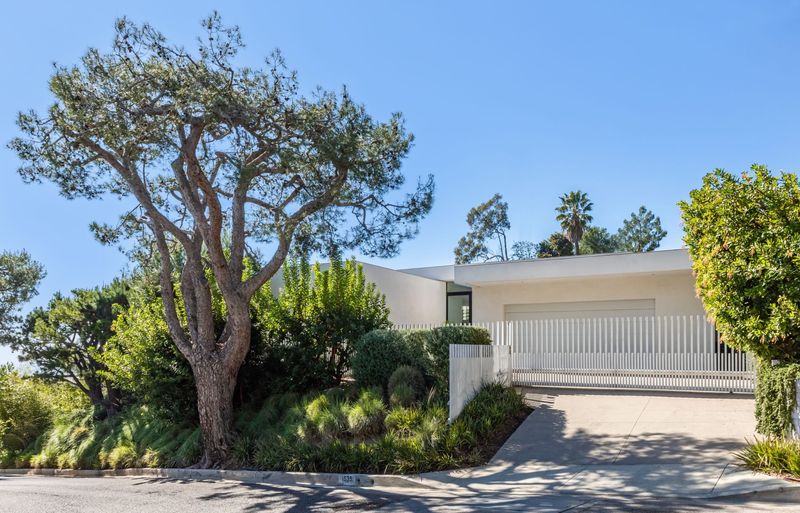 Gated motor court under a mature tree at 1535 Carla Ridge, Trousdale Estates — photo 6 of 10