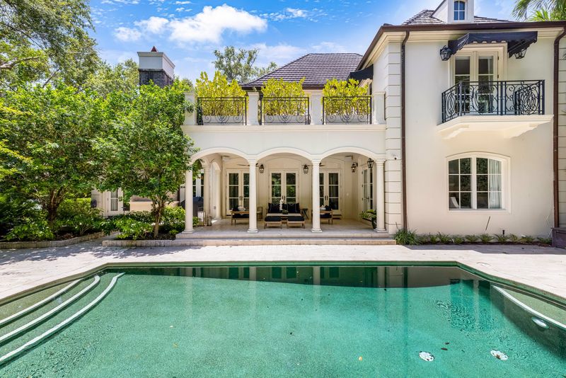 Rear facade and heated pool at 155 San Souci Drive, Coral Gables