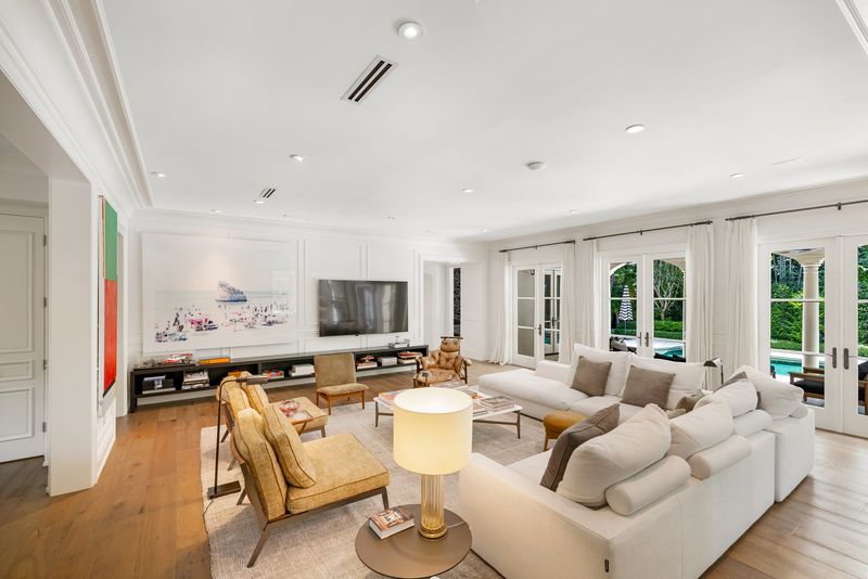 Living room with French doors at 155 San Souci Drive, Coral Gables — photo 8 of 9