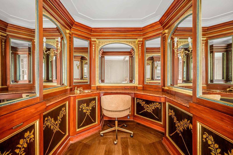 Mirrored dressing room with gilt-framed arched mirrors at 160 Central Park South 915, Central Park South — photo 2 of 6