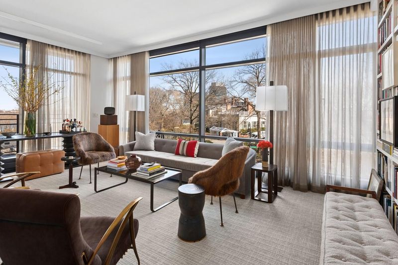 Living room and corner window wall from the dining side at 170 East End Avenue 3J, Upper East Side — photo 2 of 9