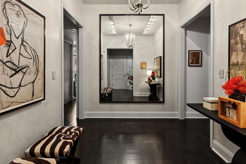 Entry gallery with dark-stained floors at 170 East End Avenue 3J, Upper East Side — photo 9 of 9