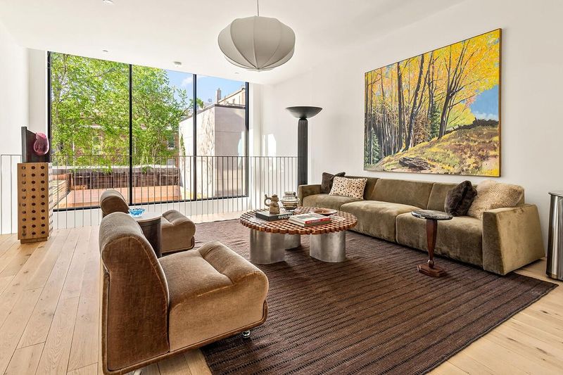 Second sitting room with glass wall to a planted terrace at 172 North 6th Street, Williamsburg — photo 5 of 8