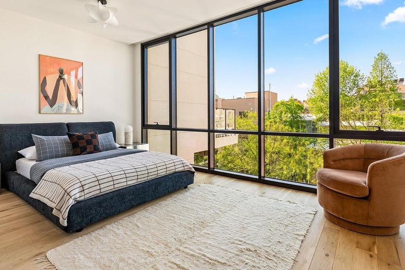 Corner bedroom with floor-to-ceiling windows at 172 North 6th Street, Williamsburg — photo 6 of 8
