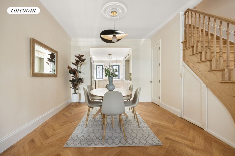 Dining area and custom staircase at 198 Putnam Avenue, Bedford-Stuyvesant — photo 3 of 10