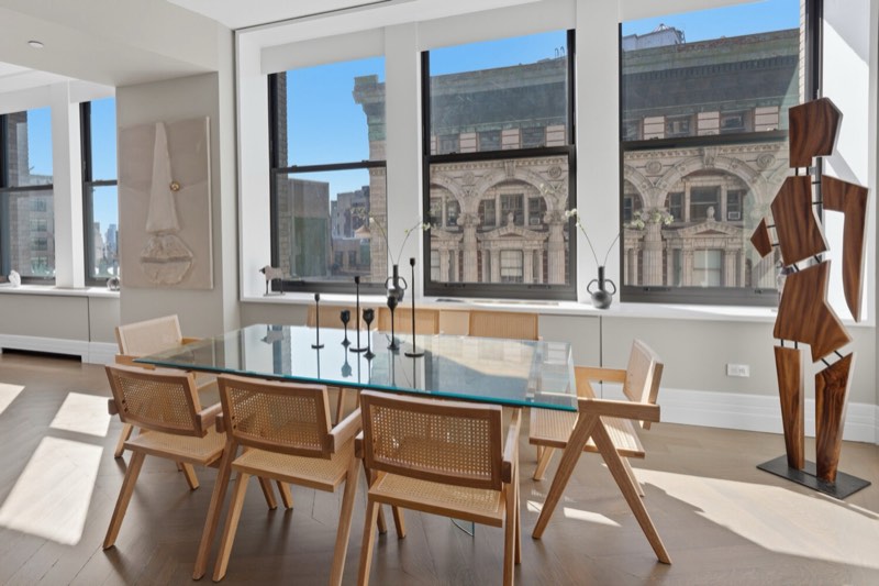 dining, three windows over masonry facades