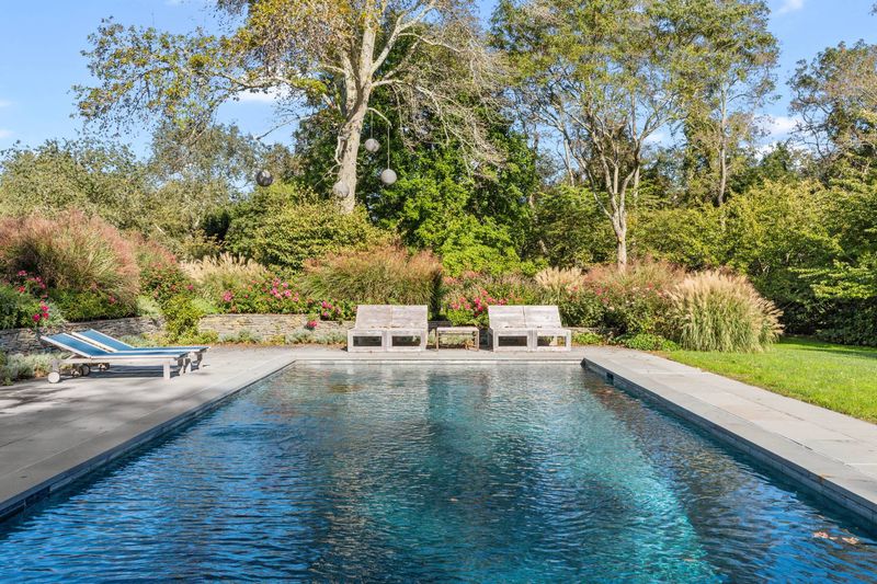Heated gunite pool with slate coping and gardens at 216 Sagaponack Road, Bridgehampton — photo 2 of 12