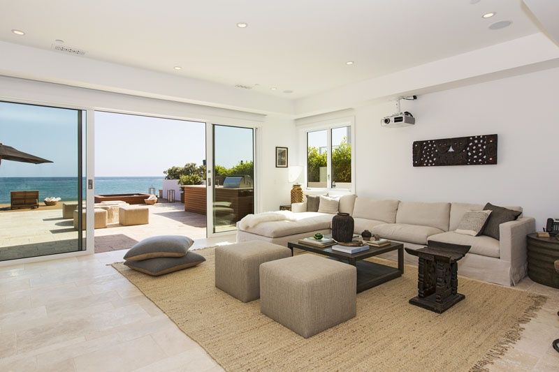 Family room open to the deck and Pacific at 23812 Malibu Road, Malibu — photo 7 of 8