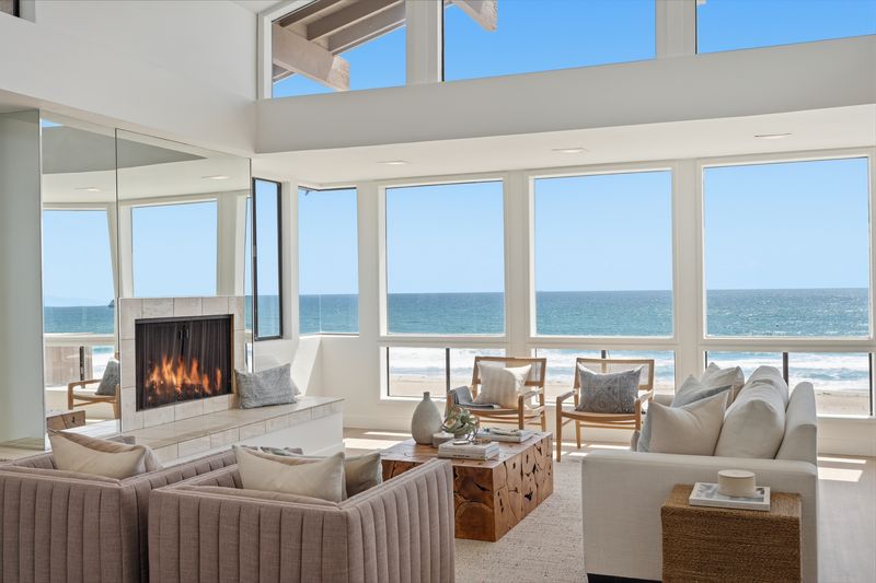 Upper living room with fireplace and ocean view at 2516 The Strand, Manhattan Beach