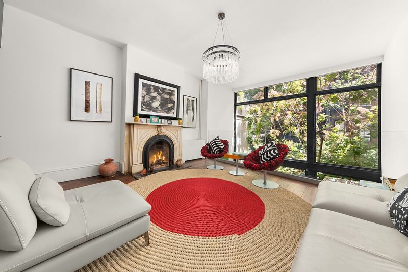 Living area with marble fireplace at 264 West 12th Street, West Village — photo 2 of 9