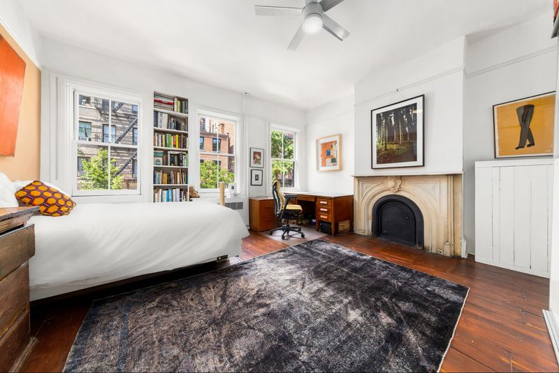 Second bedroom with marble fireplace at 264 West 12th Street, West Village — photo 7 of 9