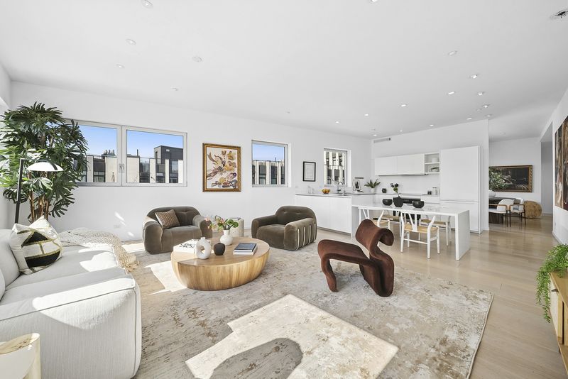 Open living and dining with kitchen beyond at 265 Wythe Avenue 4, Williamsburg