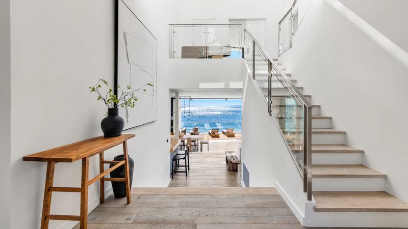 Floating stair and gallery hall at 26814 Malibu Cove Colony Drive, Malibu — photo 9 of 10