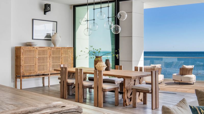 Dining room and terrace lounge at 26814 Malibu Cove Colony Drive, Malibu — photo 10 of 10
