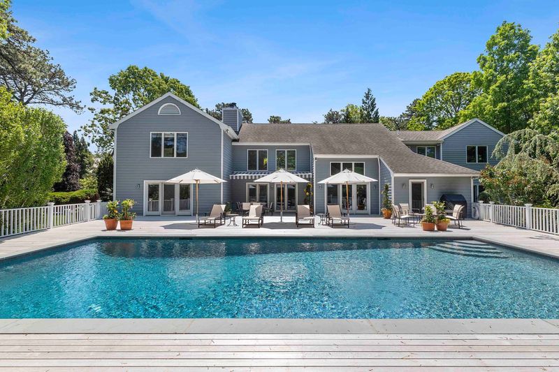 Heated gunite pool and mahogany decking at 3 Acorn Path, Quogue