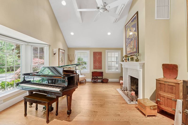 Music room with fireplace at 3 Whitney Lane, Wainscott — photo 6 of 8