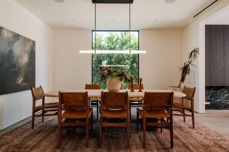 Formal dining room under a sculptural pendant at 317 South Wetherly Drive, Beverly Hills — photo 4 of 9