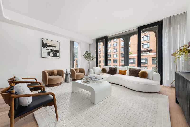 Living room with corner windows at 325 West Broadway 7B, SoHo