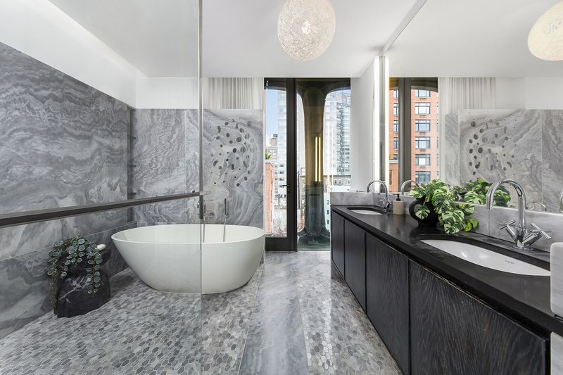 Primary bath with freestanding soaking tub at 325 West Broadway 7B, SoHo — photo 7 of 13