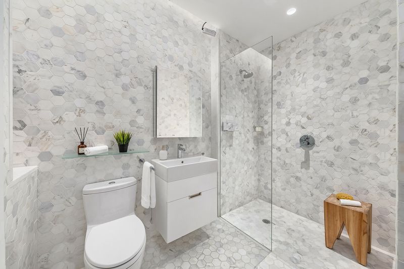 Bath with glass-enclosed shower at 325 West Broadway 7B, SoHo — photo 13 of 13