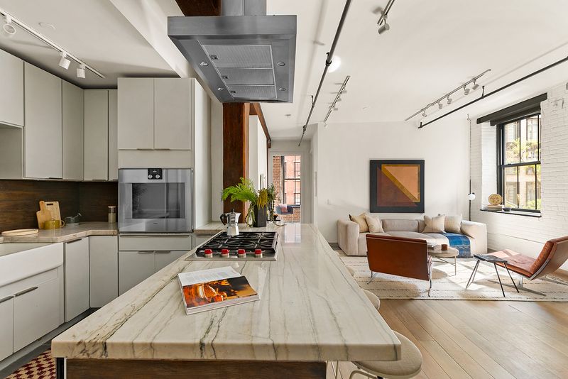 Chef's kitchen island at 33 Bleecker Street 3B, NoHo — photo 5 of 9
