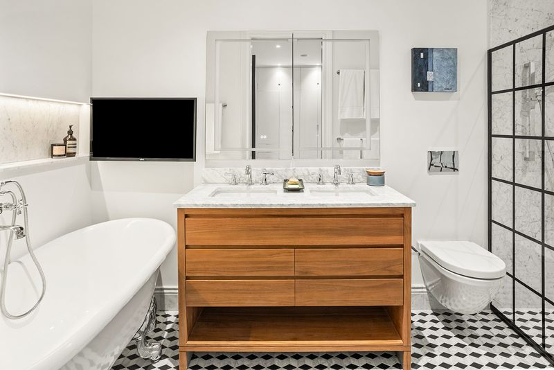 Carrara primary bath, clawfoot tub at The Atelier, 33 West 67th Street 4M, Upper West Side — photo 5 of 8