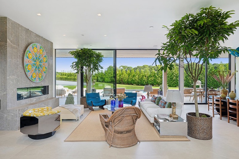 Living room with linear gas fireplace at 392 Seven Ponds Towd Road, Water Mill — photo 4 of 10