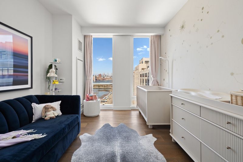Bedroom with built-ins at 50 Bridge Park Drive 16B, Brooklyn Heights — photo 6 of 12