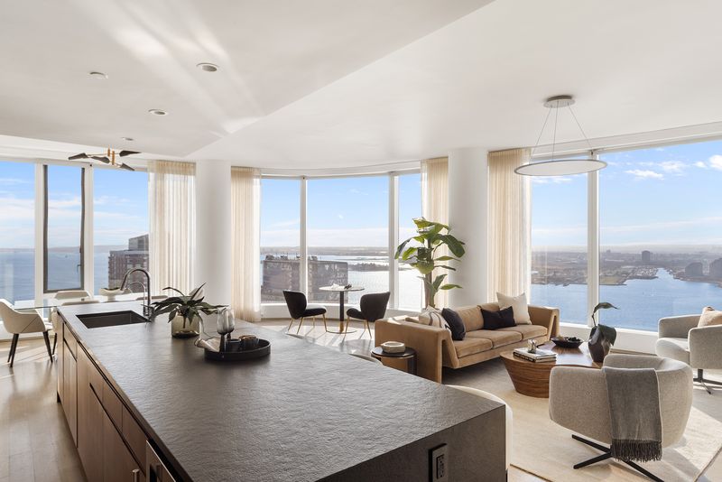 Open kitchen and great room at 50 West Street 37C, Financial District — photo 6 of 9