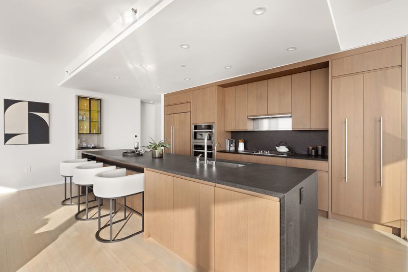 Kitchen island at 50 West Street 37C, Financial District — photo 7 of 9