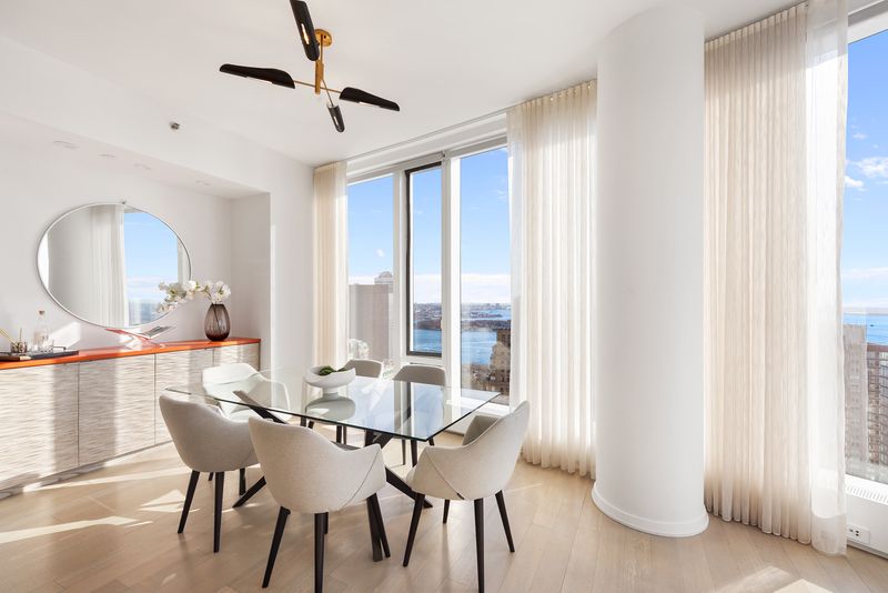 Dining room credenza at 50 West Street 37C, Financial District — photo 8 of 9
