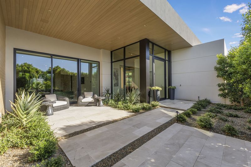 Glass entry courtyard at 5441 E Via Buena Vista, Paradise Valley — photo 9 of 10