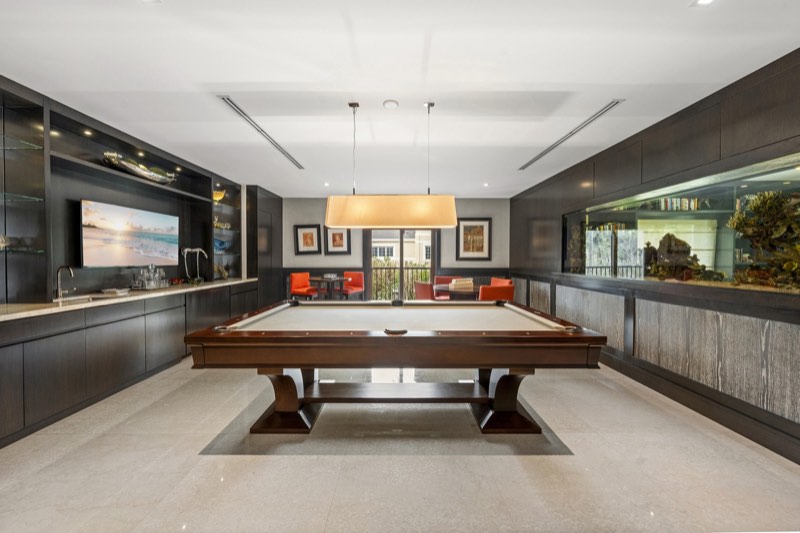 billiards room and aquarium wall at 555 Arvida Parkway